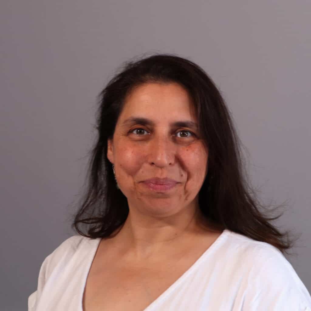 Image shows white woman with long dark hair Head Shot