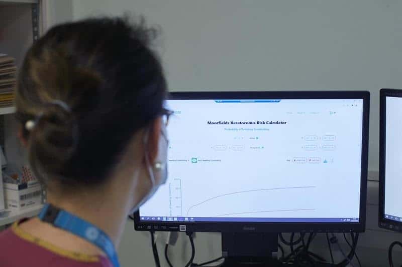 Image shows person at computer screen using the calculator featured in the story