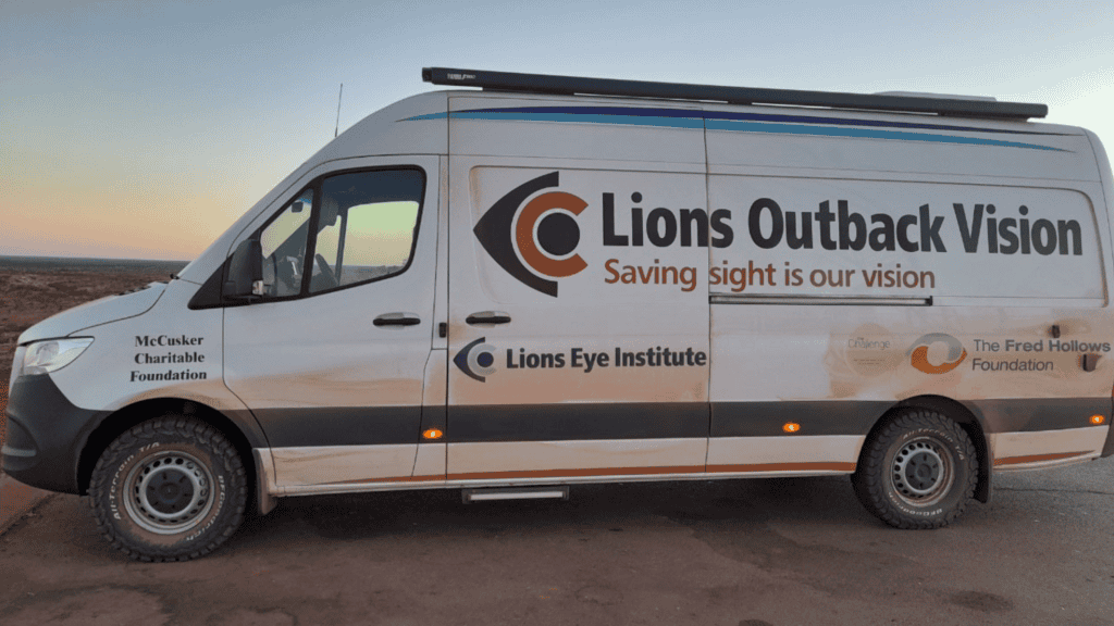 parked van with the text of 'Lions Outback vision saving sight is our vision. Lions Eye institute, the fred hollows foundation and McCusker charitable foundation