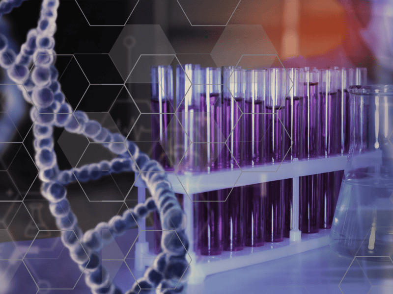image shows test tubes with purple liquid, overlaid with a graphic of DNA and some hexagonal notes