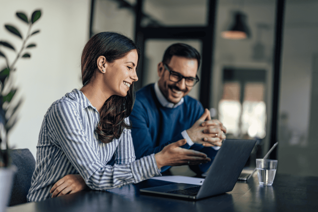 Image shows two professionals at a desk
