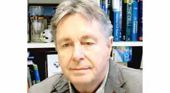 Image shows a head shot of white male professor Uwe Wolfrum